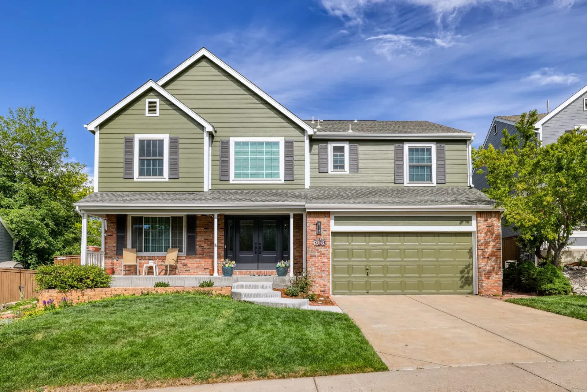 A suburban house after new James Hardie siding replacement in Highlands Ranch, CO.