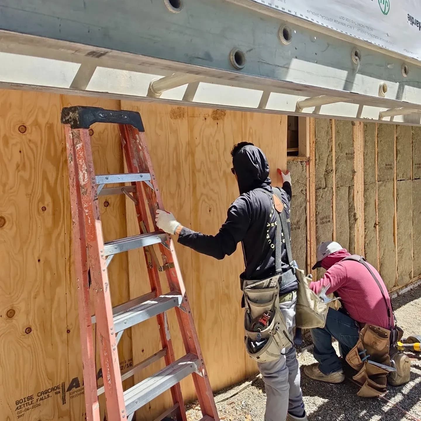 The Roofing & Siding Company crew installing new sheathing for a siding replacement project in Boulder, CO.