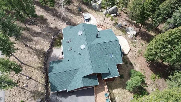 Aerial view of a completed roof replacement in Evergreen, CO