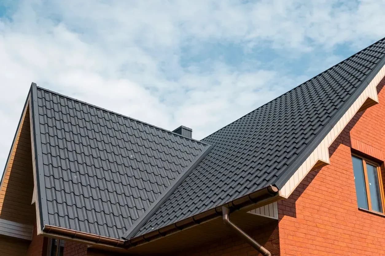 Roofing crew installing shingles on a Denver home