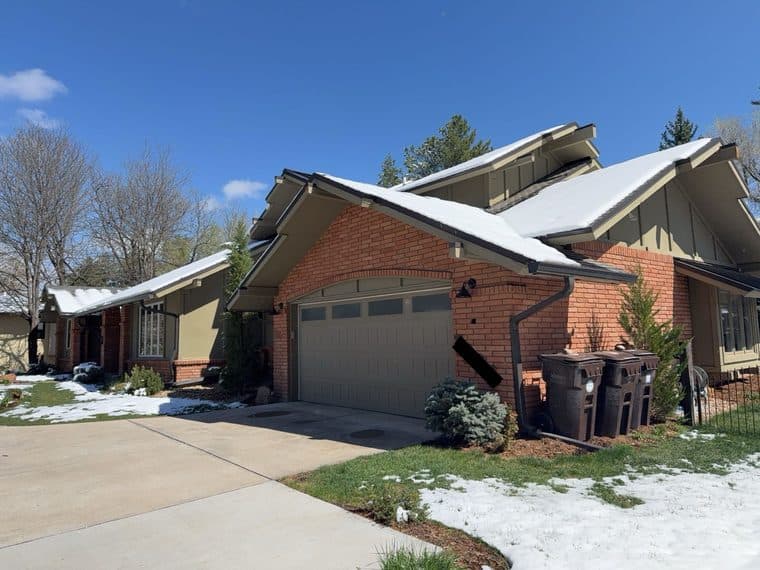 Boulder CO home with brick and original siding before full exterior remodel with James Hardie and stone veneer
