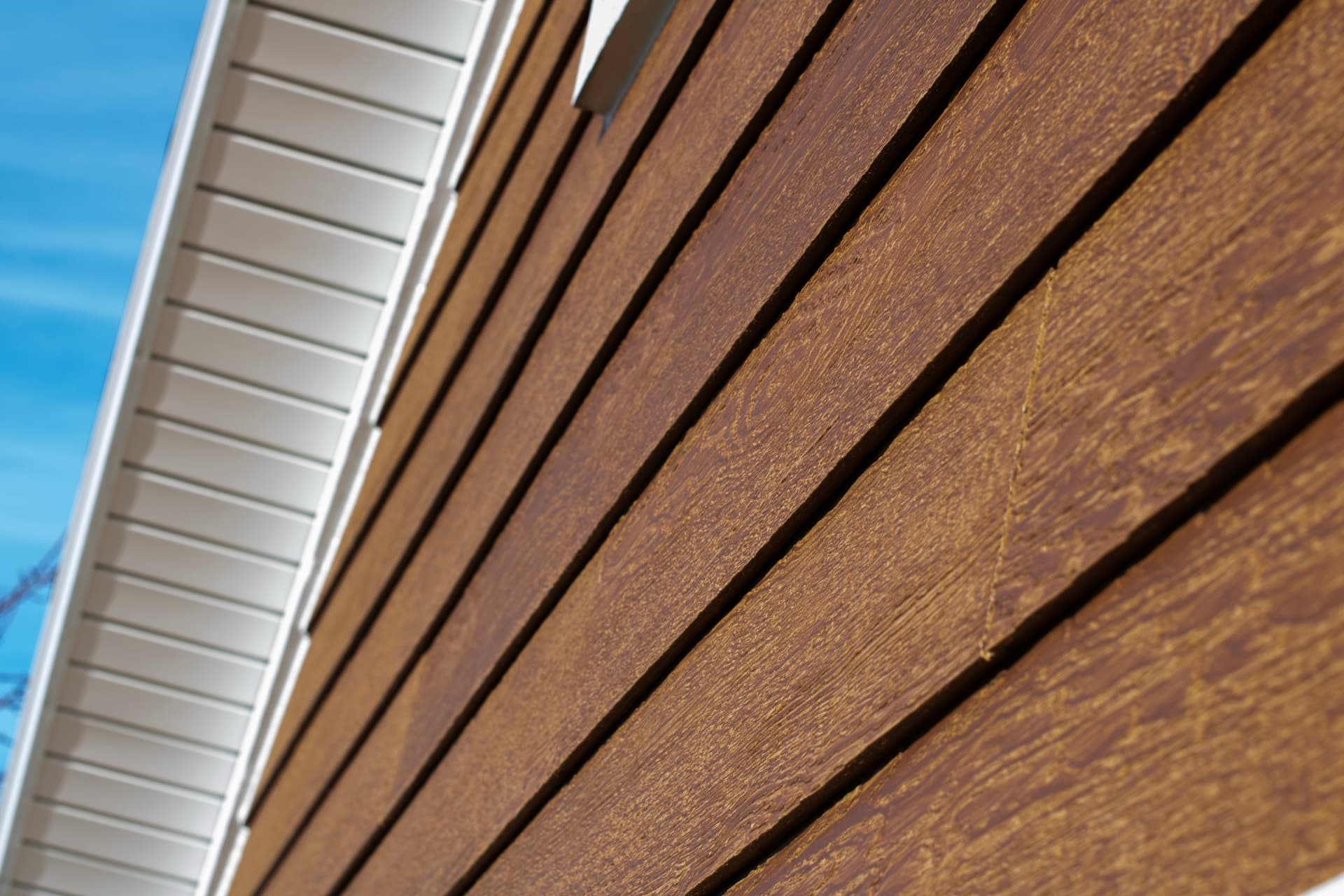LP SmartSide ExpertFinish engineered wood siding in Saffron Cedar close-up detail