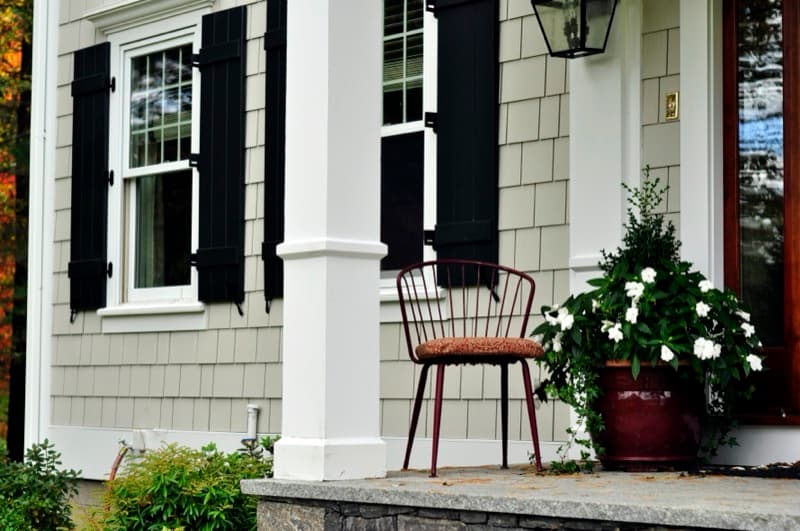 Hardie Shingle fiber cement siding on classic home exterior with porch