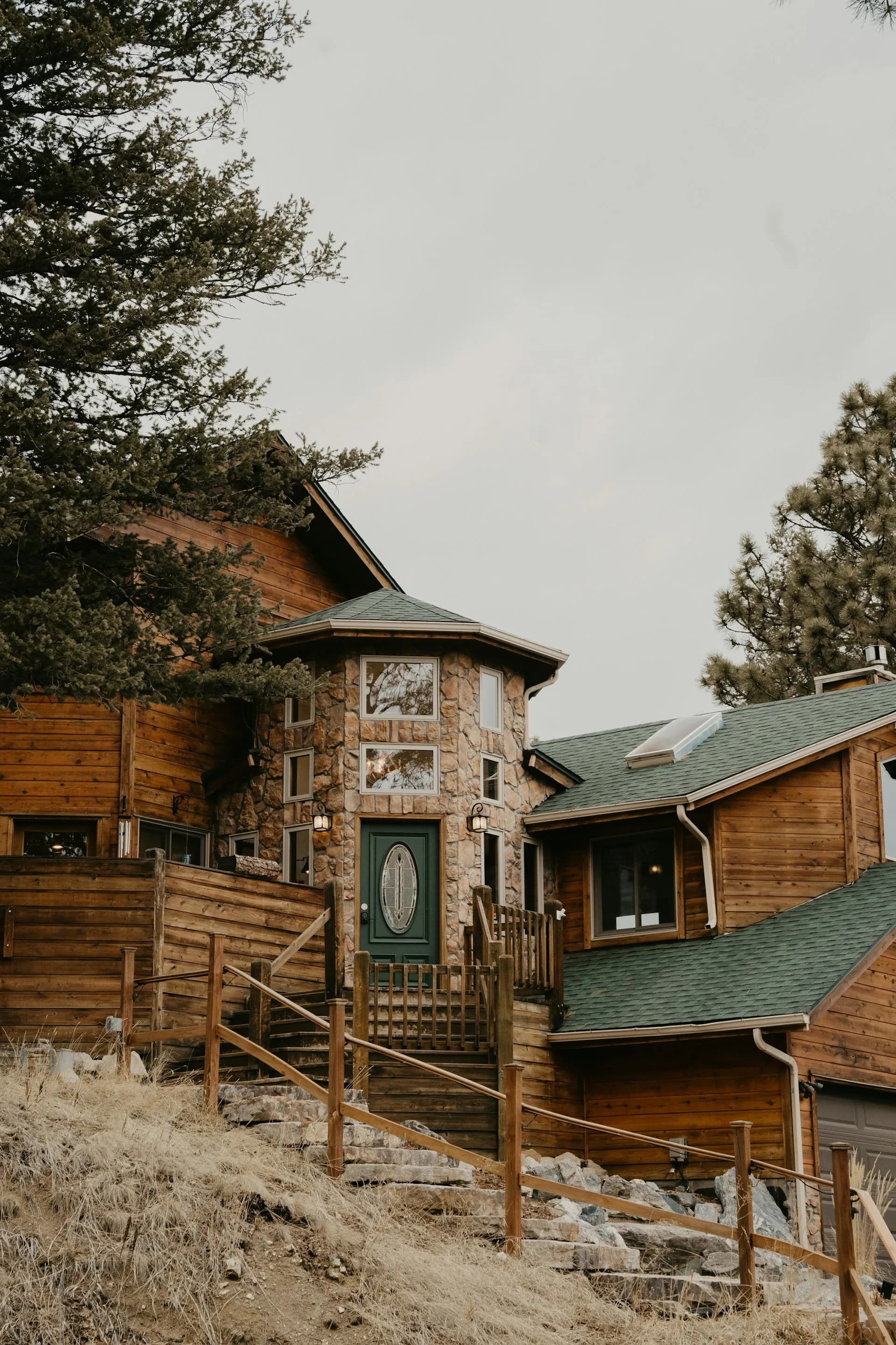 Mountain home with wood and stone siding in the Golden Colorado foothills