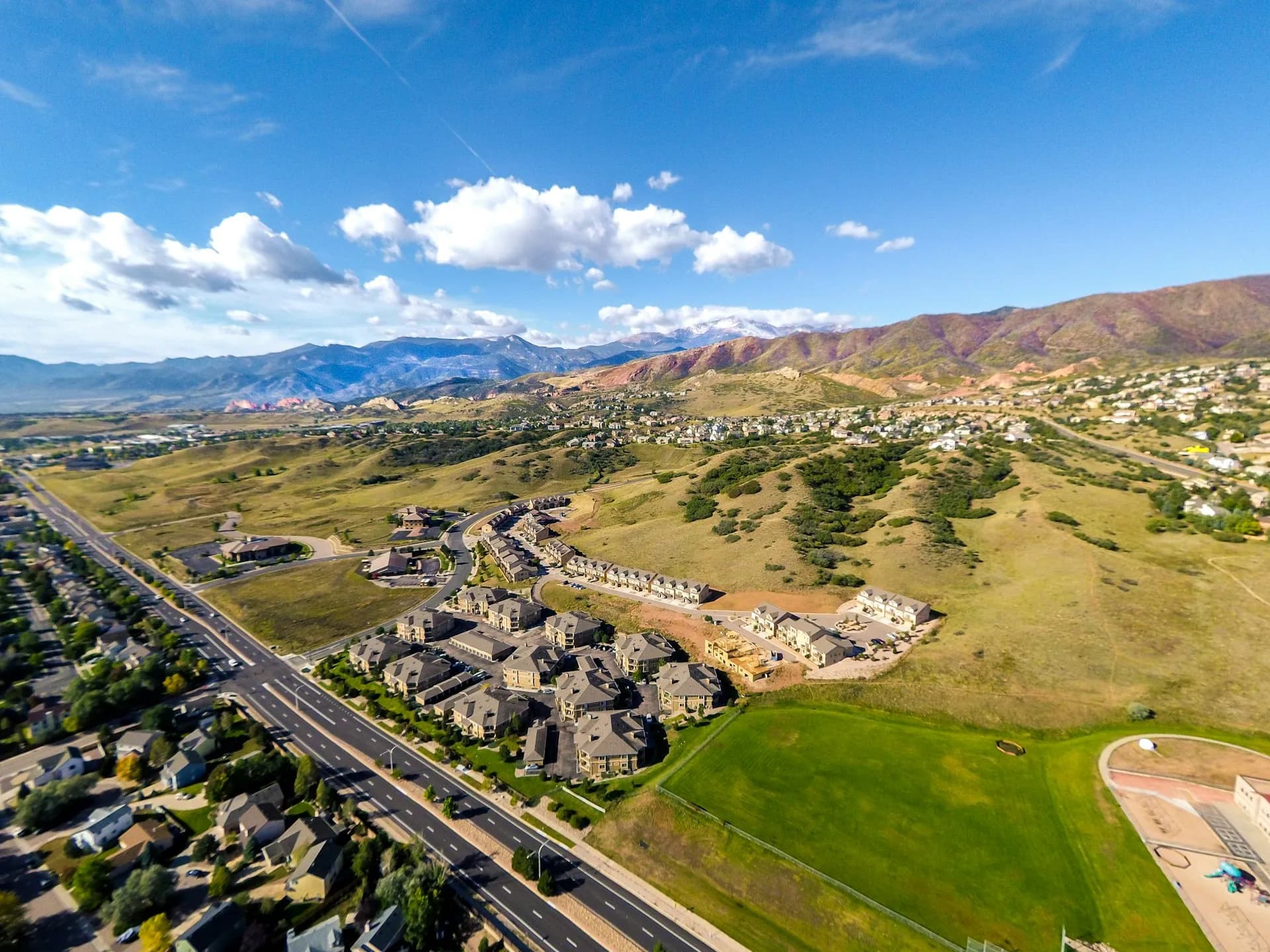 Aerial view of residential community in Highlands Ranch Colorado with mountain backdrop