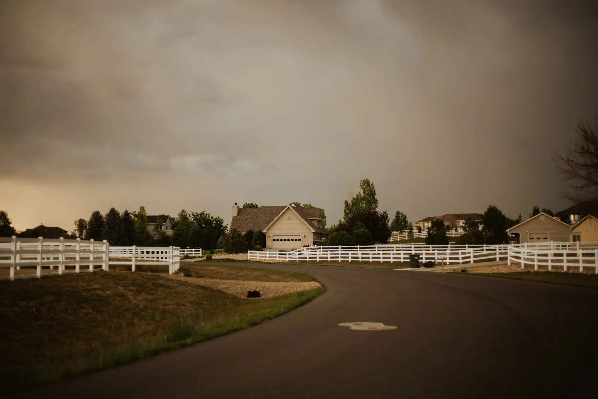Residential homes with white fences in a Lakewood Colorado neighborhood