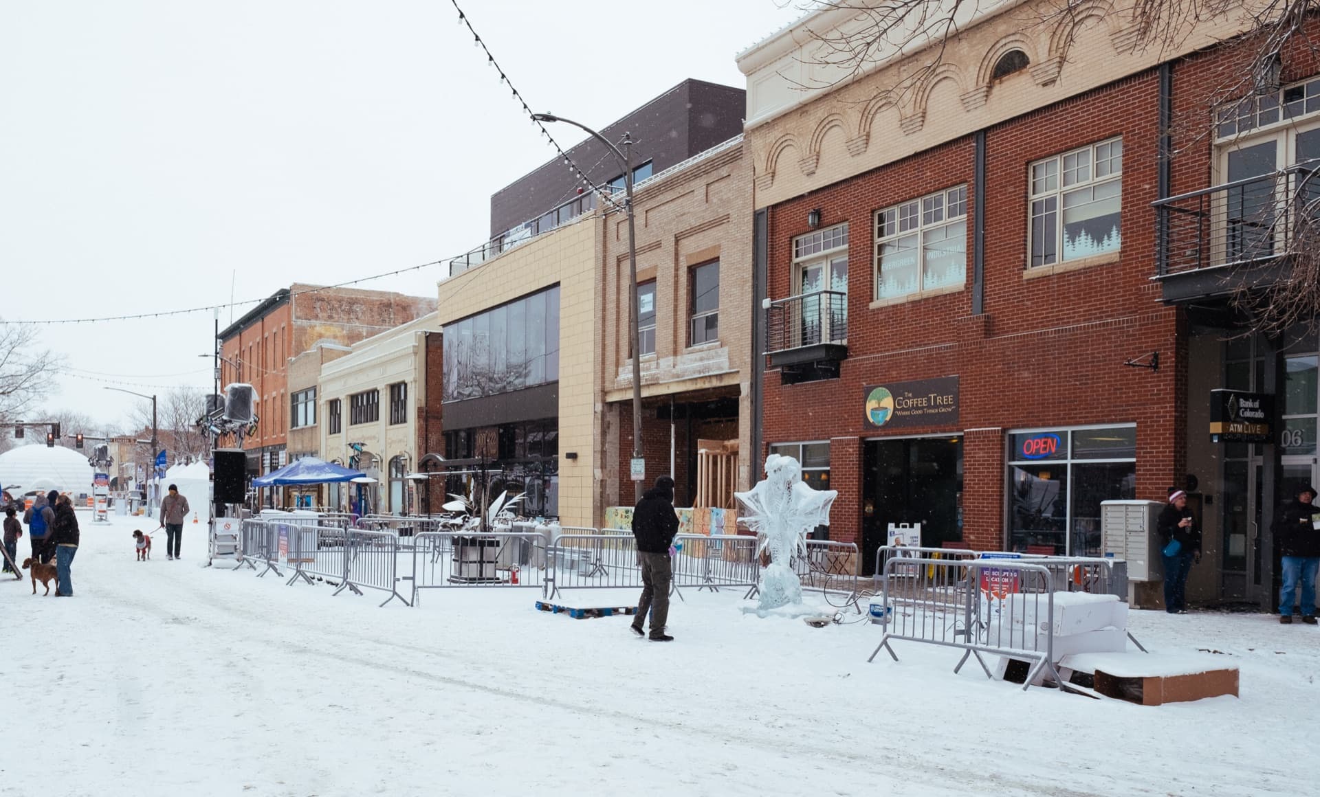 Downtown Loveland Colorado in winter with historic brick buildings and ice sculptures