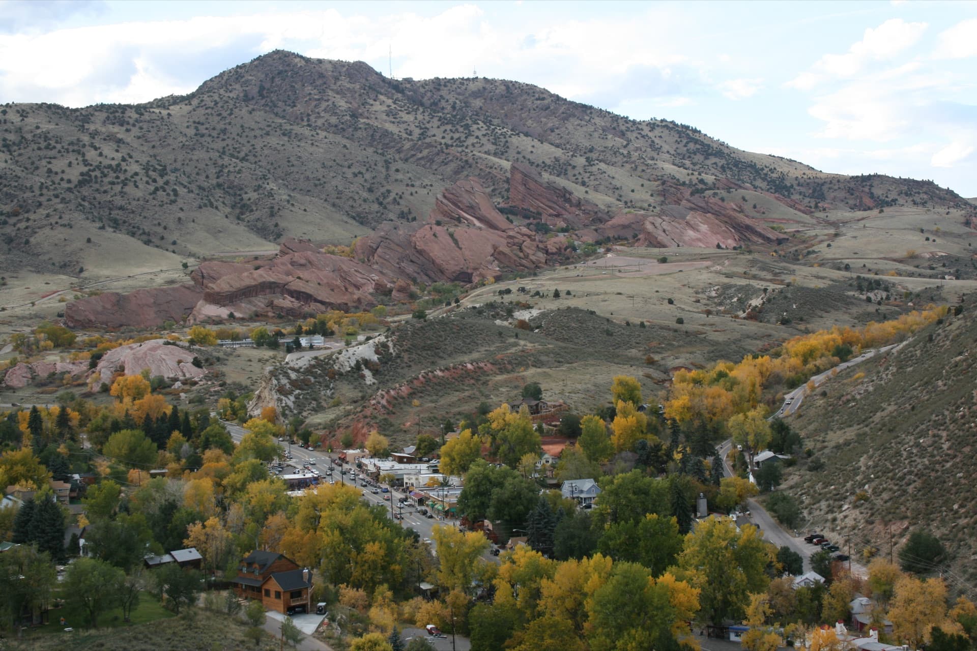 Aerial view of Morrison Colorado town nestled in the red rock foothills with fall foliage
