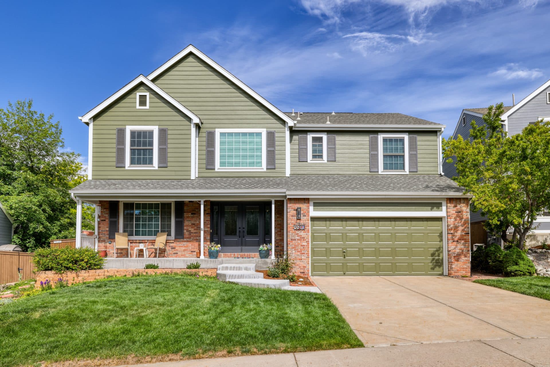 After — James Hardie Siding, ProVia Front Door, and Gutters in Highlands Ranch