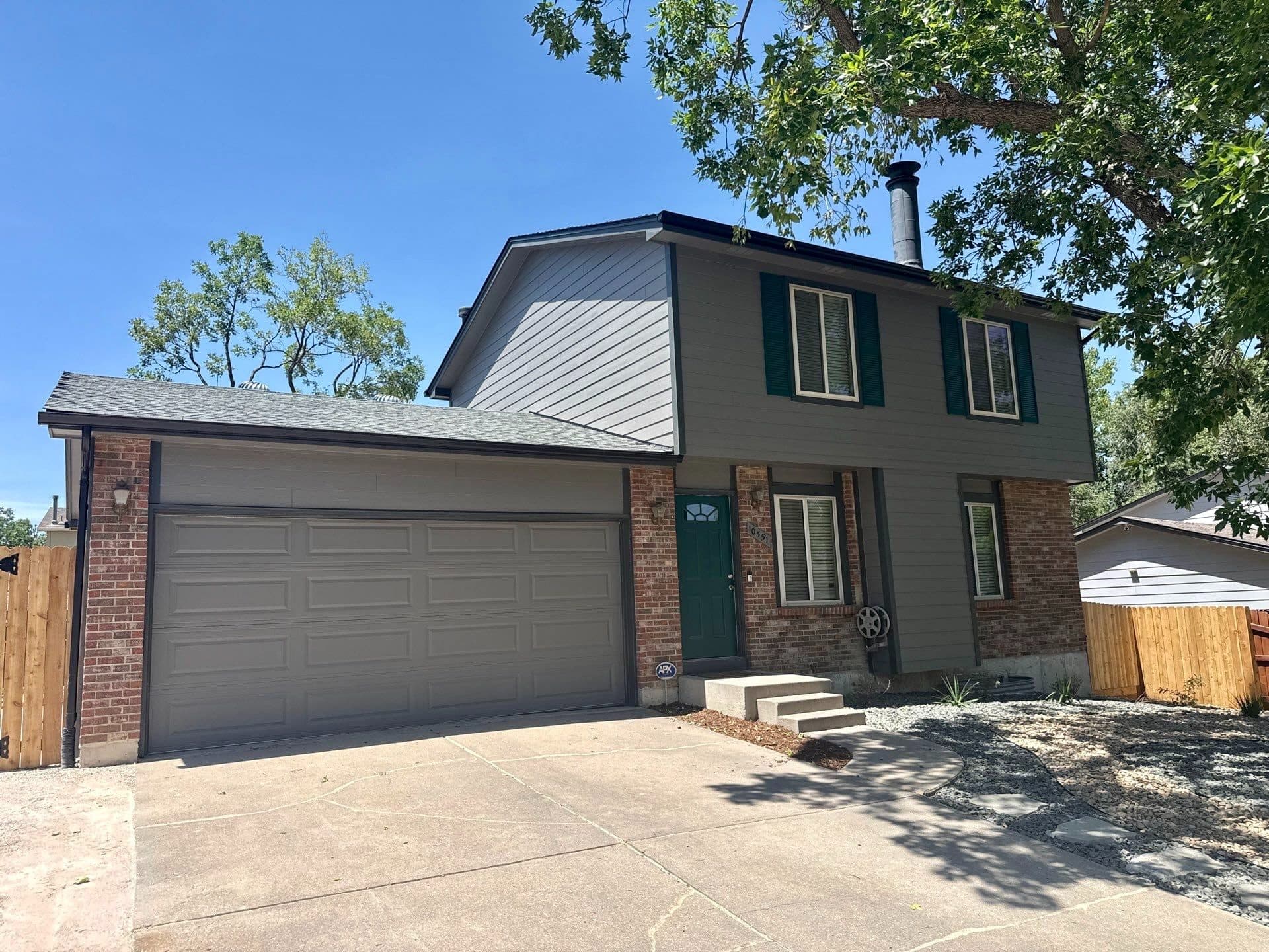 New James Hardie siding in Aged Pewter with Iron Gray trim on a home in Westminster, Colorado.