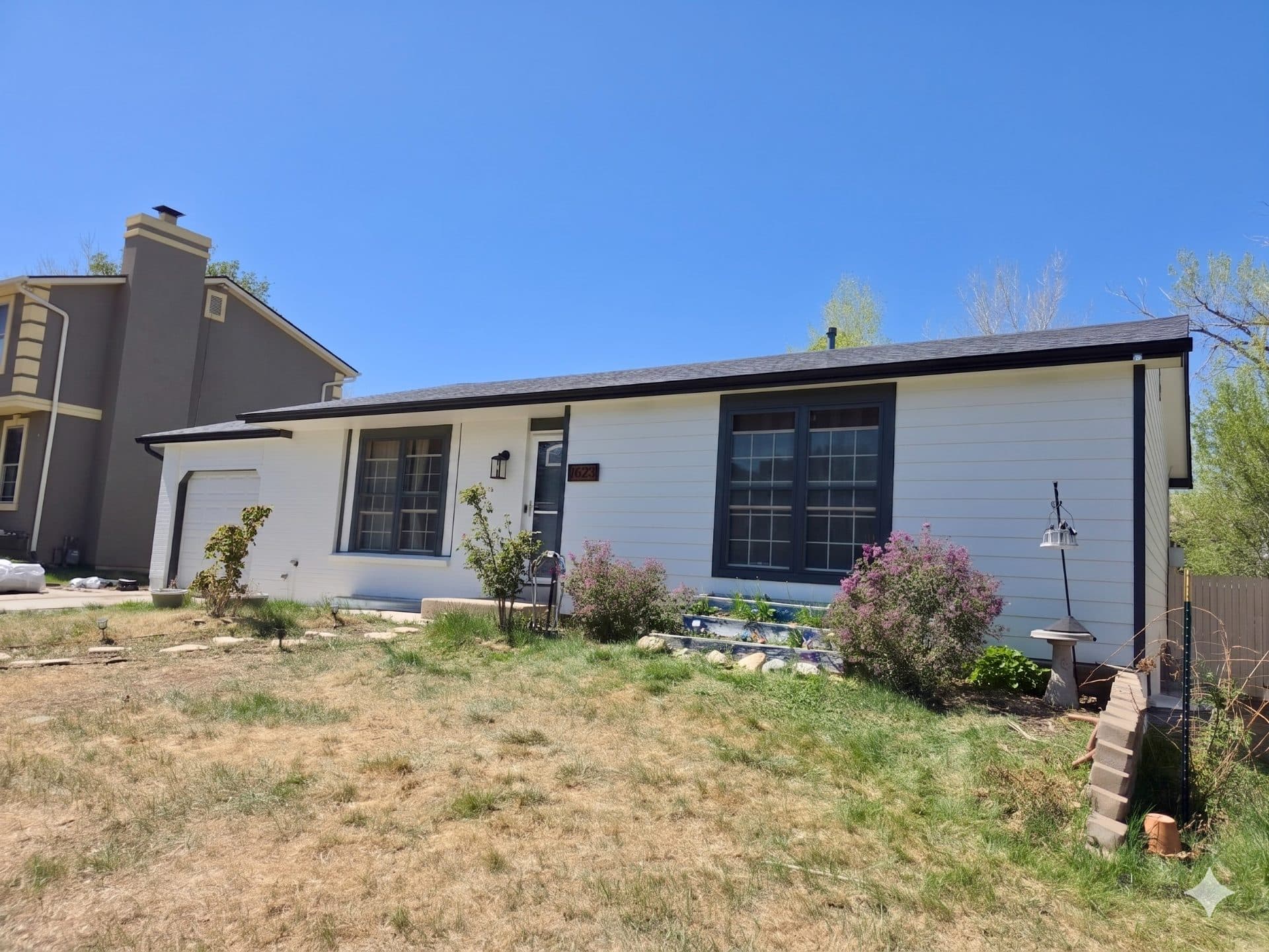 After — Aurora Exterior Refresh: James Hardie Siding, Painted Brick, and New Gutters