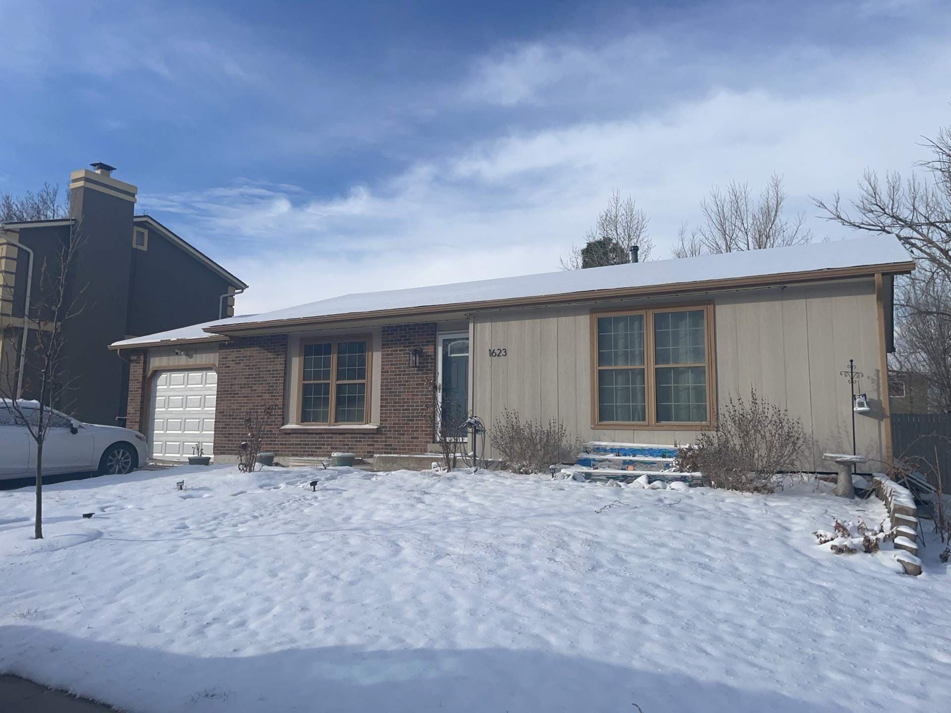 Before — Aurora Exterior Refresh: James Hardie Siding, Painted Brick, and New Gutters