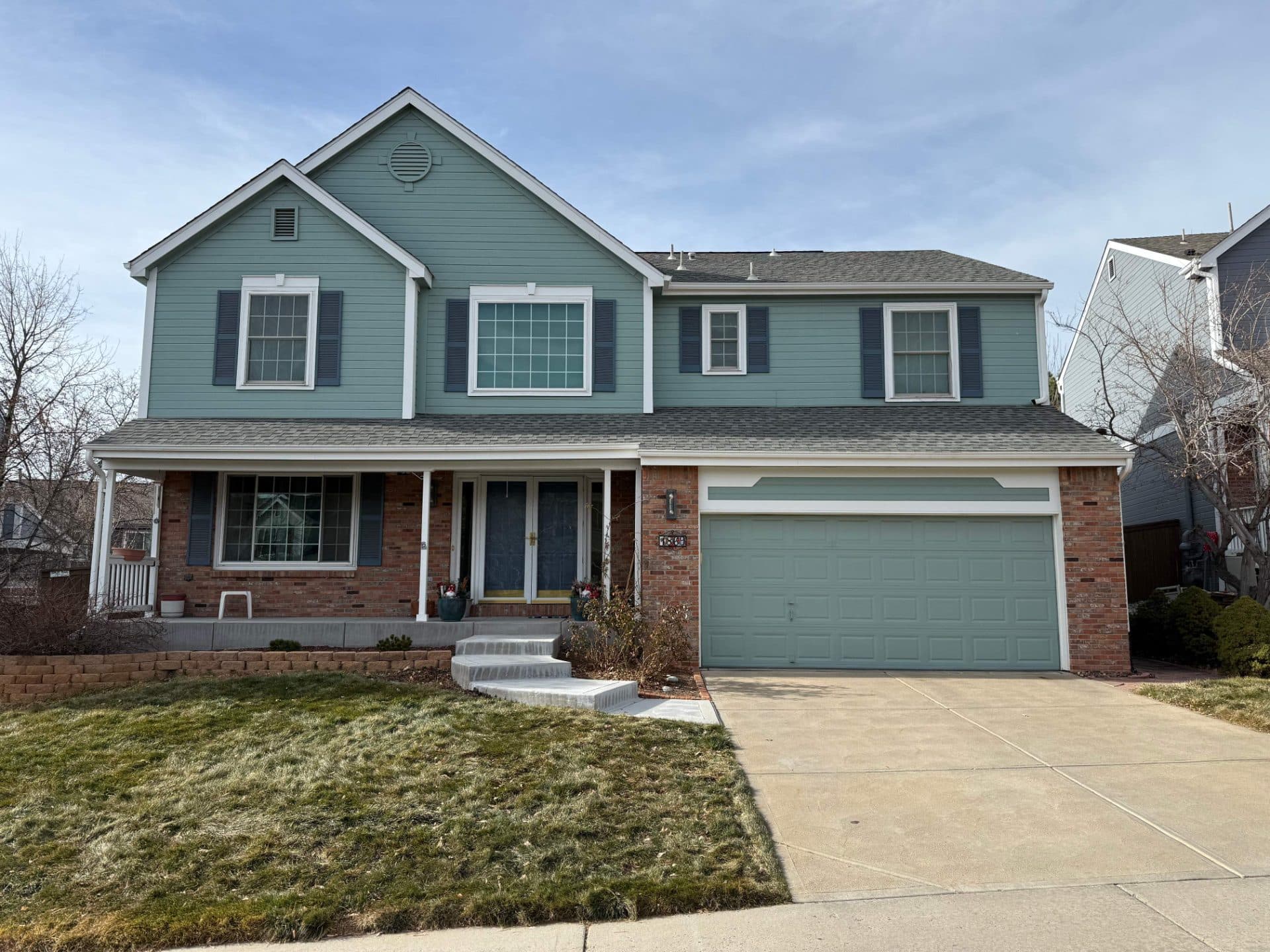 Before — James Hardie Siding, ProVia Front Door, and Gutters in Highlands Ranch