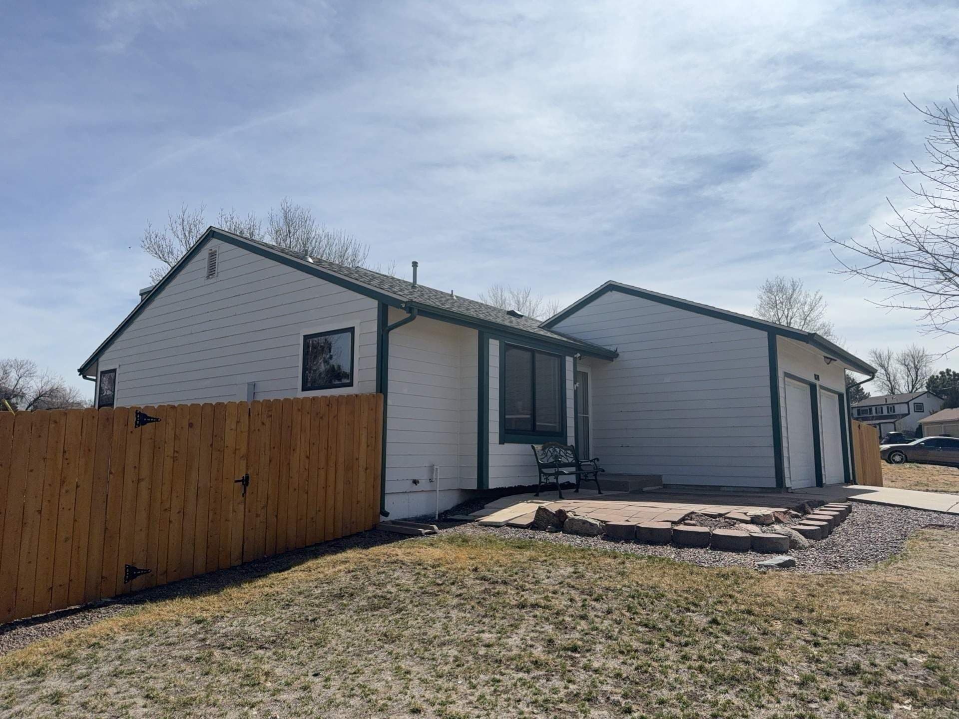 Before — Full Exterior Siding Replacement in Centennial, CO. James Hardie in Aged Pewter and Cobblestone