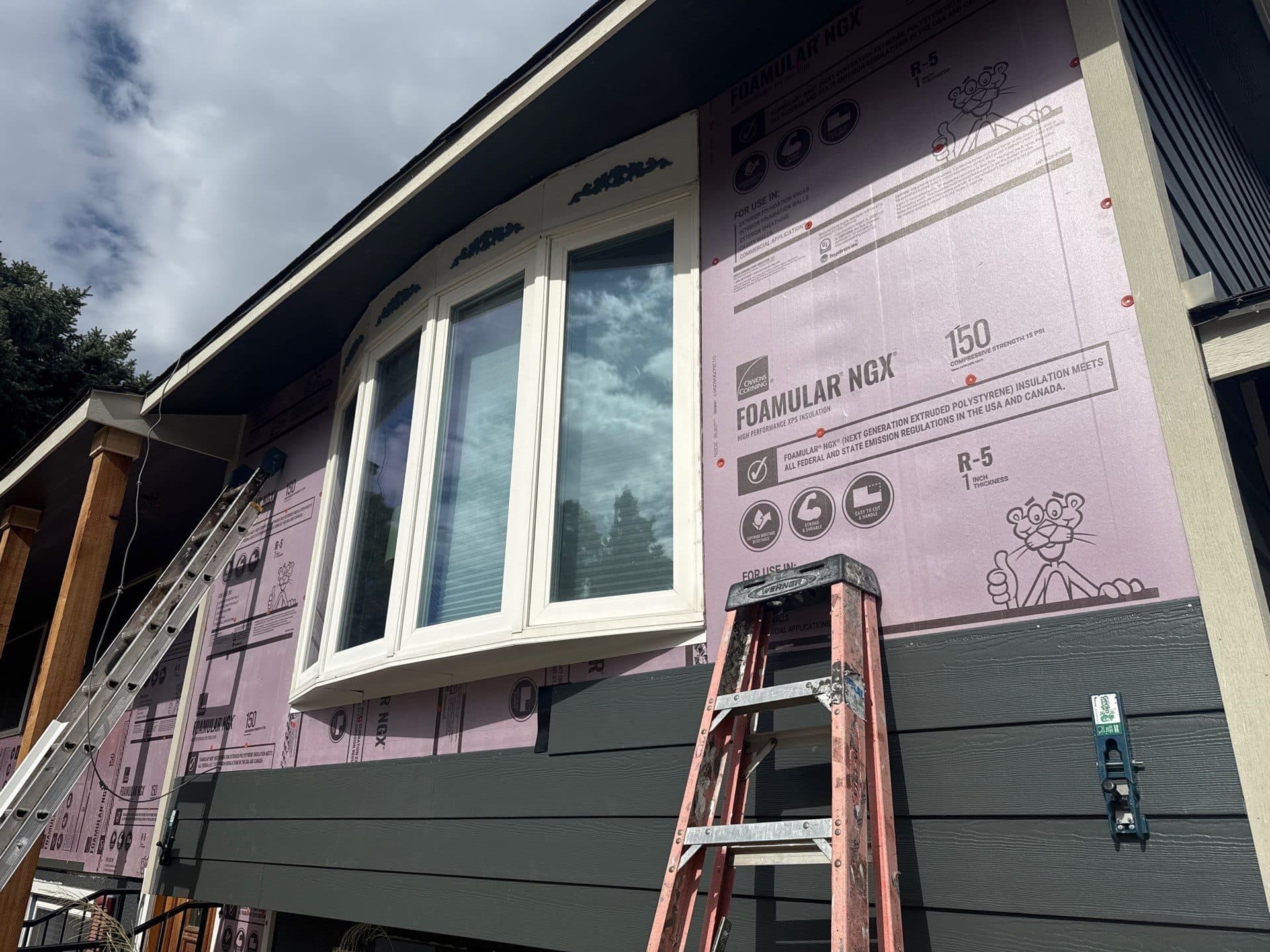 James Hardie siding installation project in progress showing new foamular ngx insulation underneath.