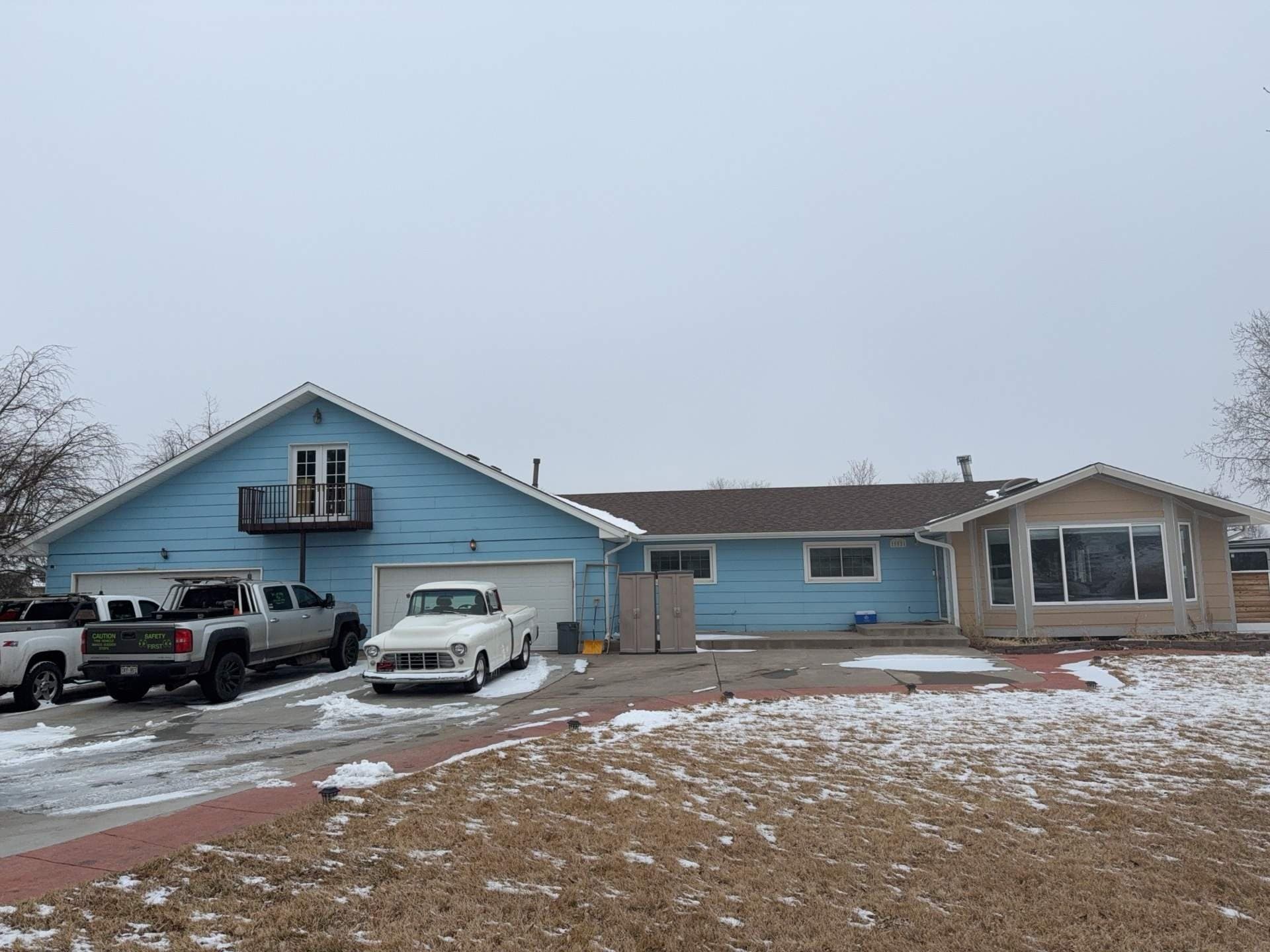Before — LP SmartSide siding with Versetta Stone accents & new soffits and fascia — Brighton, CO