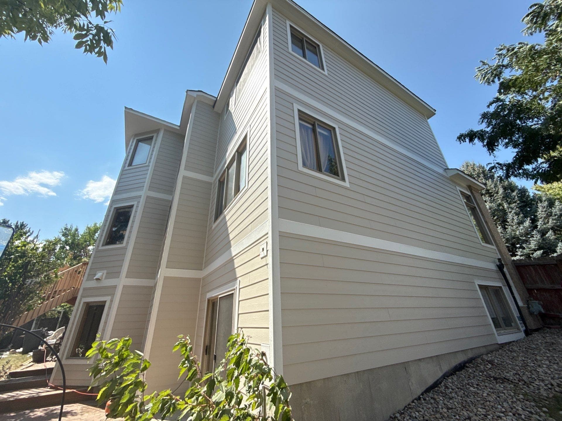 Full James Hardie siding trim soffits and fascia replacement with new gutters on Broomfield Colorado home
