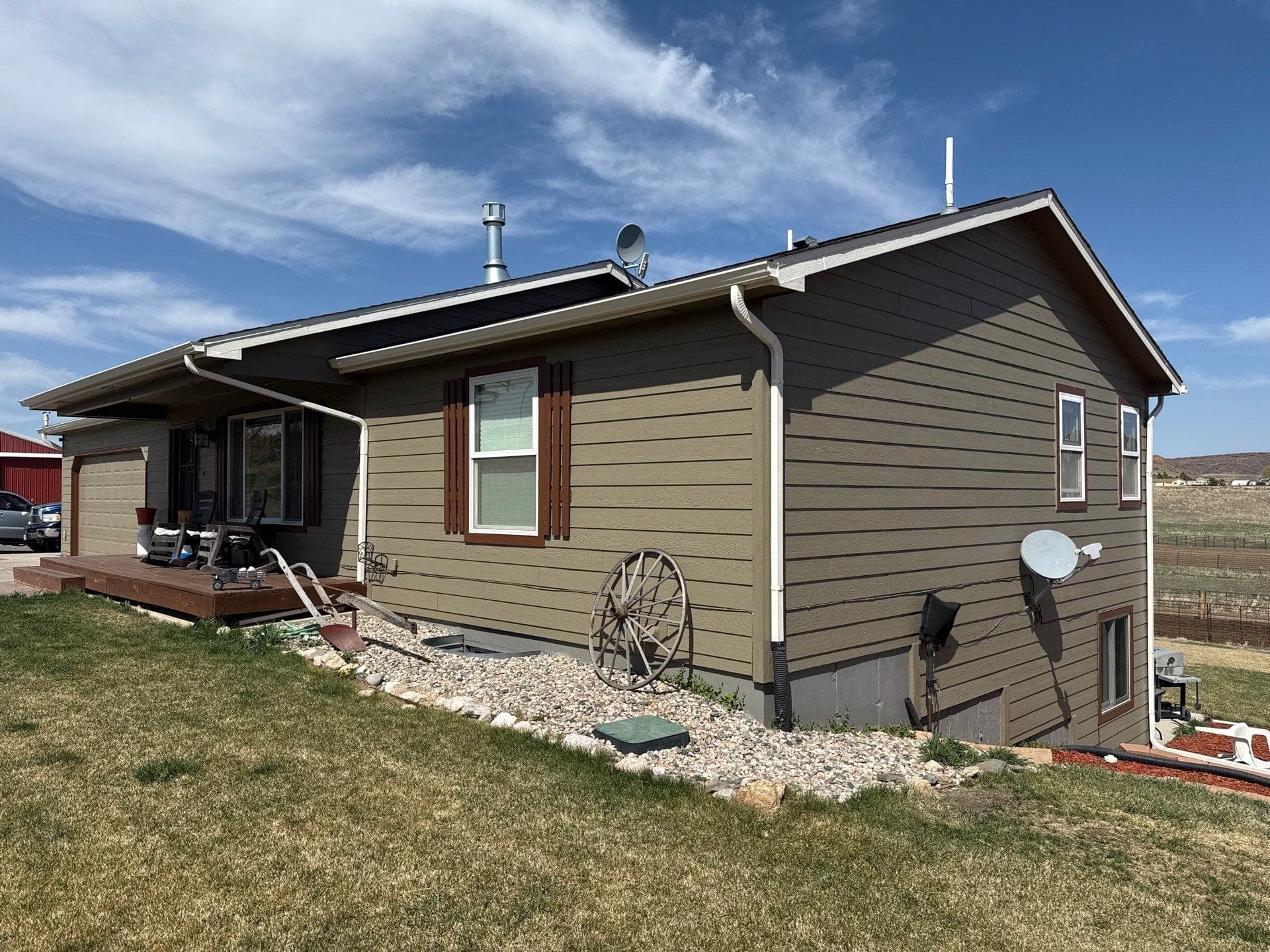 LP SmartSide siding with painted soffits fascia trim and doors on Loveland Colorado home