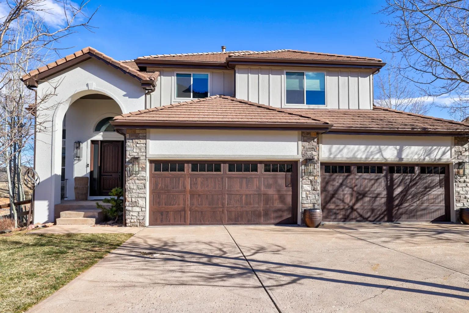 James Hardie board and batten siding with Longboard aluminum soffits and new gutters in Morrison Colorado