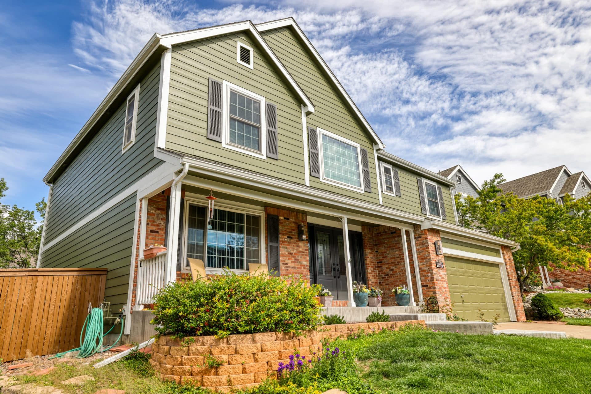 Home in Highlands Ranch, Colorado with new James Hardie fiber cement siding in ColorPlus Mountain Sage.
