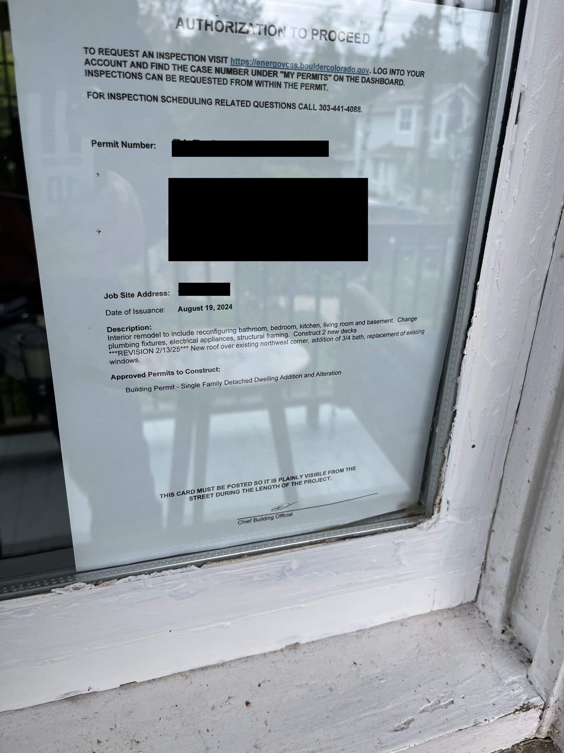 Photo of a permit card posted on a house in Boulder, Colorado.
