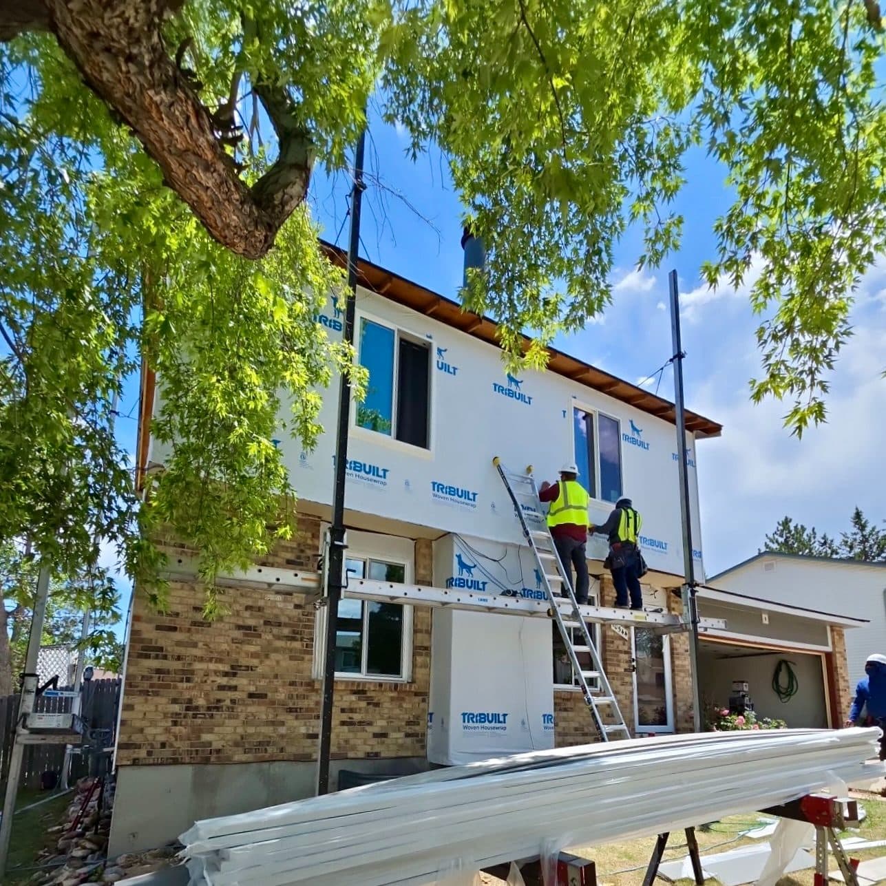The Roofing & Siding Company crew working on a siding installation in Westminster, CO.